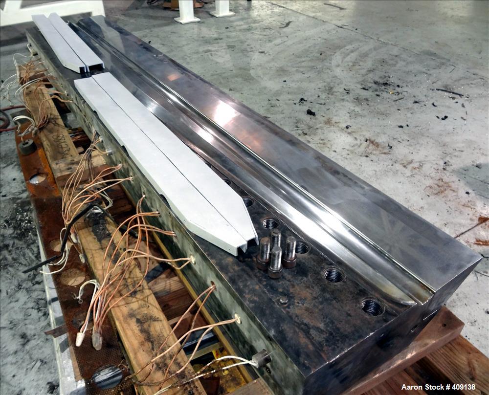 Used 78" wide sheet die. 1" diameter back center feed.