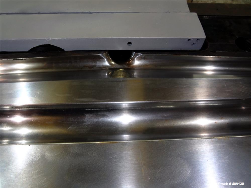 Used 78" wide sheet die. 1" diameter back center feed.