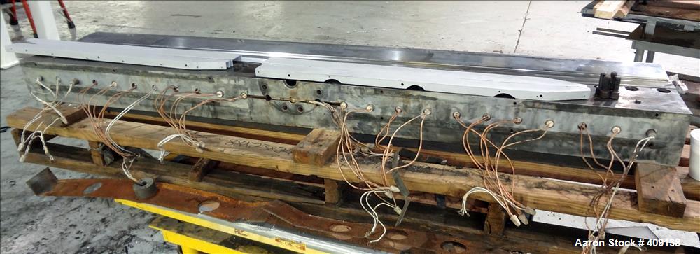 Used 78" wide sheet die. 1" diameter back center feed.