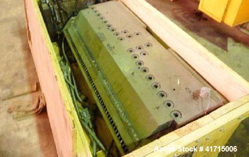 Used Cloeren 56" Wide Flex Lip Sheet Die. Back center feed, replaceable lower lip, gap 0.010-0.090. Last Used Running Polypropylene sheet.