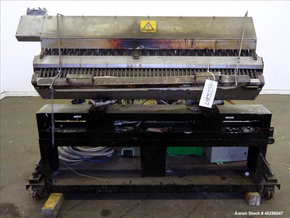 Used Cloeren 54" wide sheet die, back center feed, serial# 05-7969-7, built 2004, mounted on a cart