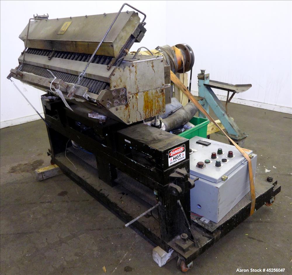 Used Cloeren 54" wide sheet die, back center feed, serial# 05-7969-7, built 2004, mounted on a cart