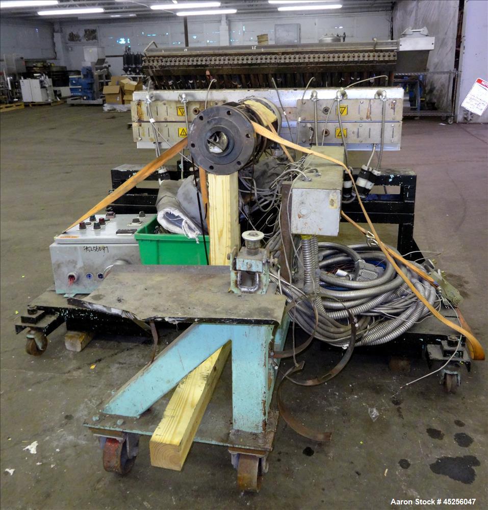 Used Cloeren 54" wide sheet die, back center feed, serial# 05-7969-7, built 2004, mounted on a cart