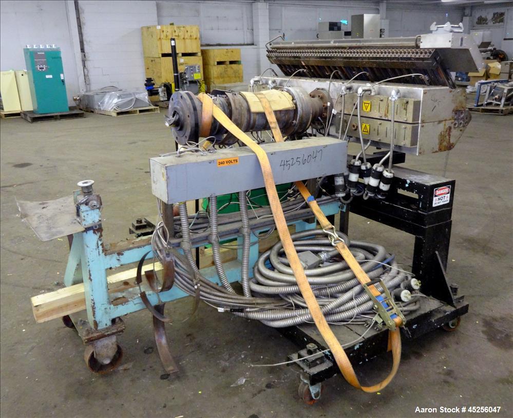 Used Cloeren 54" wide sheet die, back center feed, serial# 05-7969-7, built 2004, mounted on a cart