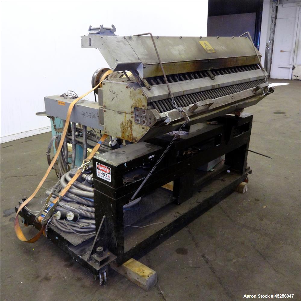 Used Cloeren 54" wide sheet die, back center feed, serial# 05-7969-7, built 2004, mounted on a cart