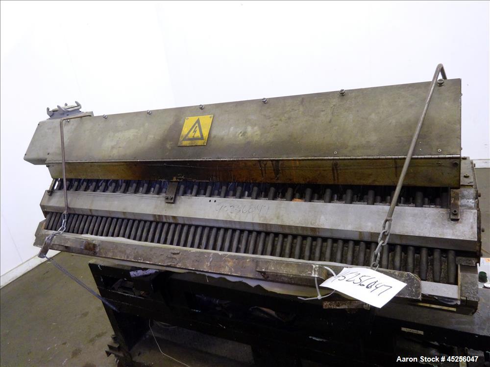 Used Cloeren 54" wide sheet die, back center feed, serial# 05-7969-7, built 2004, mounted on a cart