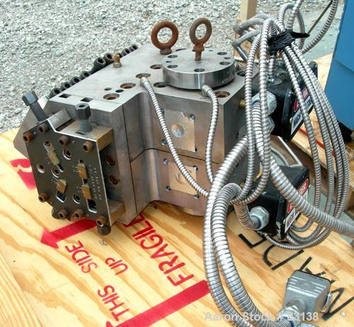 Used Cloeren 5 Layer Co-Extrusion Sheet Die, 10" wide. 1/2" back center feed. Missing side plate and lower lip.