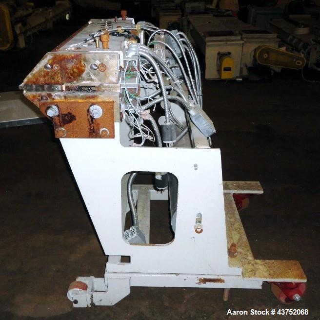 Used EDI 32" Wide Flex Lip Sheet Die, Model H-75. Replaceable bottom lip, no chocker bar. Mounted on a cart. Serial# 93-1553. Last used with a 2.5" extrusion line.