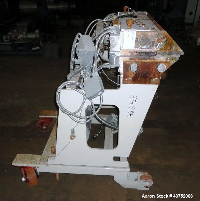 Used EDI 32" Wide Flex Lip Sheet Die, Model H-75. Replaceable bottom lip, no chocker bar. Mounted on a cart. Serial# 93-1553. Last used with a 2.5" extrusion line.