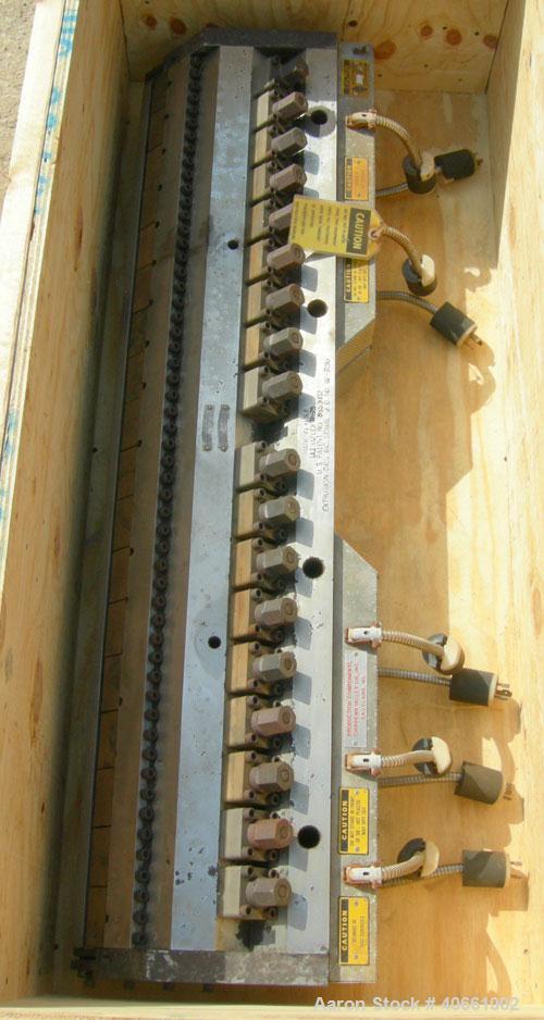 Used EDI Ultraflex R-75, 54" wide die. 1.25" diameter entrance. 1 phase, 230 volt. 3 lower lips with a range of .015" - .090", .085" - .160", and .155" - .230". Includes 1 die lip.