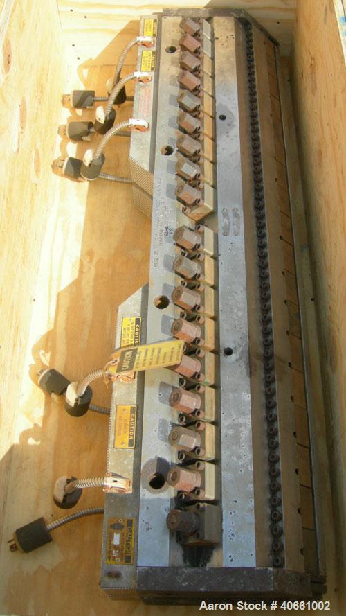 Used EDI Ultraflex R-75, 54" wide die. 1.25" diameter entrance. 1 phase, 230 volt. 3 lower lips with a range of .015" - .090", .085" - .160", and .155" - .230". Includes 1 die lip.