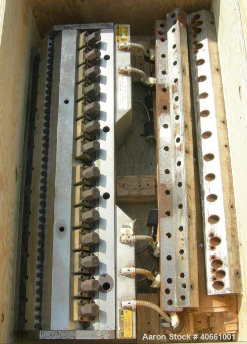 Used EDI 41" Ultraflex R75 wide die. 1 phase, 230 volt. 1.25" diameter entrance. Lip opening range .001" - .075". Includes 8 die lips.