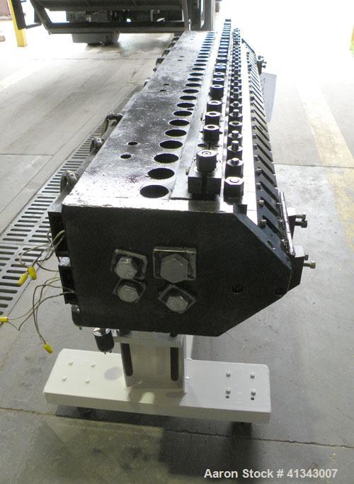 Used Titan Sheet Die, 78" wide. Approximate 1-5/8" diameter back center feed. Mounted on a cart with casters.