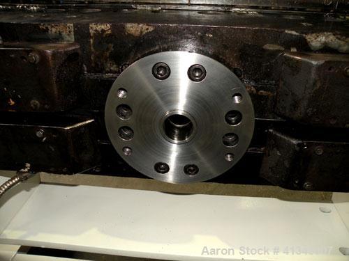 Used Titan Sheet Die, 78" wide. Approximate 1-5/8" diameter back center feed. Mounted on a cart with casters.