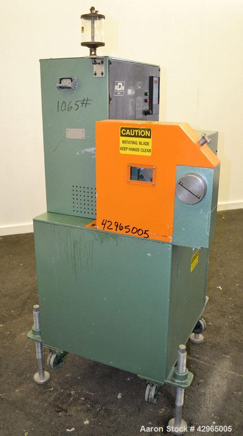  Used- RDN Rotocut Fly Knife Cutter, Model EMC-4DC. Single blade, driven by a 3hp, 180 volt, 1750/2050 rpm DC motor. Includes a control panel. Mounted on (4) adjustable legs, and casters.