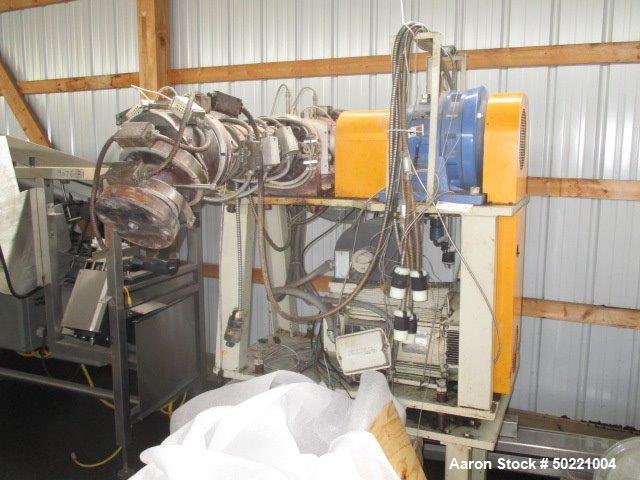 Used Maag Model 56/56 Melt Pump. Approximate 92.6 cubic meters per revolution. Includes approximately 10hp motor, NO controls. Serial# 8330 63034/2.