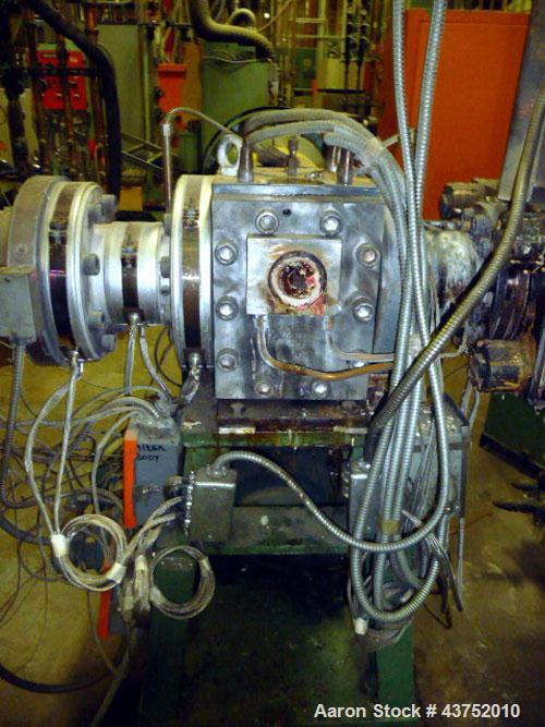 Used Maag Extrex Gear Pump, Model EX90 4STE 10/0. Driven by a 30 hp DC motor with SCR control. Includes an operator panel for pressure.