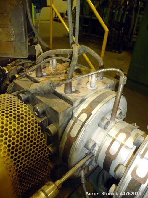 Used Maag Extrex Gear Pump, Model EX90 4STE 10/0. Driven by a 30 hp DC motor with SCR control. Includes an operator panel for pressure.