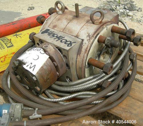 Used Maag Extrex gear pump, type 56/56. Approximately 92.6 cubic meters per revolution. Approximately 2 5/8" openings. Driven by a 15 hp, 240 volt, 1750 rpm DC motor with a reducer, ratio 20.55 to 1....