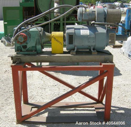 Used Maag Extrex gear pump, type 56/56. Approximately 92.6 cubic meters per revolution. Approximately 2 5/8" openings. Driven by a 15 hp, 240 volt, 1750 rpm DC motor with a reducer, ratio 20.55 to 1....