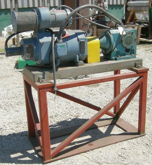 Used Maag Extrex gear pump, type 56/56. Approximately 92.6 cubic meters per revolution. Approximately 2 5/8" openings. Driven by a 15 hp, 240 volt, 1750 rpm DC motor with a reducer, ratio 20.55 to 1....