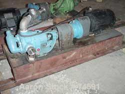 Used Viking Pump, Model K724, Stainless Steel. Approximately 35 gallons per minute at 420 RPM, 2" diameter inlet/outlet. Direct driven by a 7-1/2 HP, 3/60/230/460 Volt, 1745 RPM motor thru a reducer....