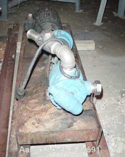 Used Viking Pump, Model K724, Stainless Steel. Approximately 35 gallons per minute at 420 RPM, 2" diameter inlet/outlet. Direct driven by a 7-1/2 HP, 3/60/230/460 Volt, 1745 RPM motor thru a reducer....