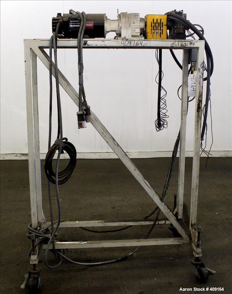 Used Zenith Melt Pump, Model 60-20000-2174-4. Approximate 1" diameter inlet/outlet. Driven by a 1 hp, 3/60/460 volt, 1750 rpm SC motor with reducer, ratio 52.69:1. Mounted on a frame with casters.