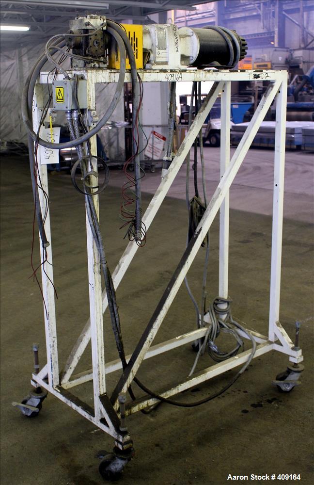 Used Zenith Melt Pump, Model 60-20000-2174-4. Approximate 1" diameter inlet/outlet. Driven by a 1 hp, 3/60/460 volt, 1750 rpm SC motor with reducer, ratio 52.69:1. Mounted on a frame with casters.