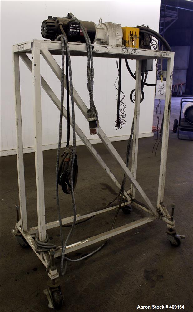 Used Zenith Melt Pump, Model 60-20000-2174-4. Approximate 1" diameter inlet/outlet. Driven by a 1 hp, 3/60/460 volt, 1750 rpm SC motor with reducer, ratio 52.69:1. Mounted on a frame with casters.