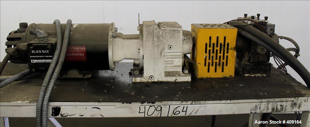 Used Zenith Melt Pump, Model 60-20000-2174-4. Approximate 1" diameter inlet/outlet. Driven by a 1 hp, 3/60/460 volt, 1750 rpm SC motor with reducer, ratio 52.69:1. Mounted on a frame with casters.