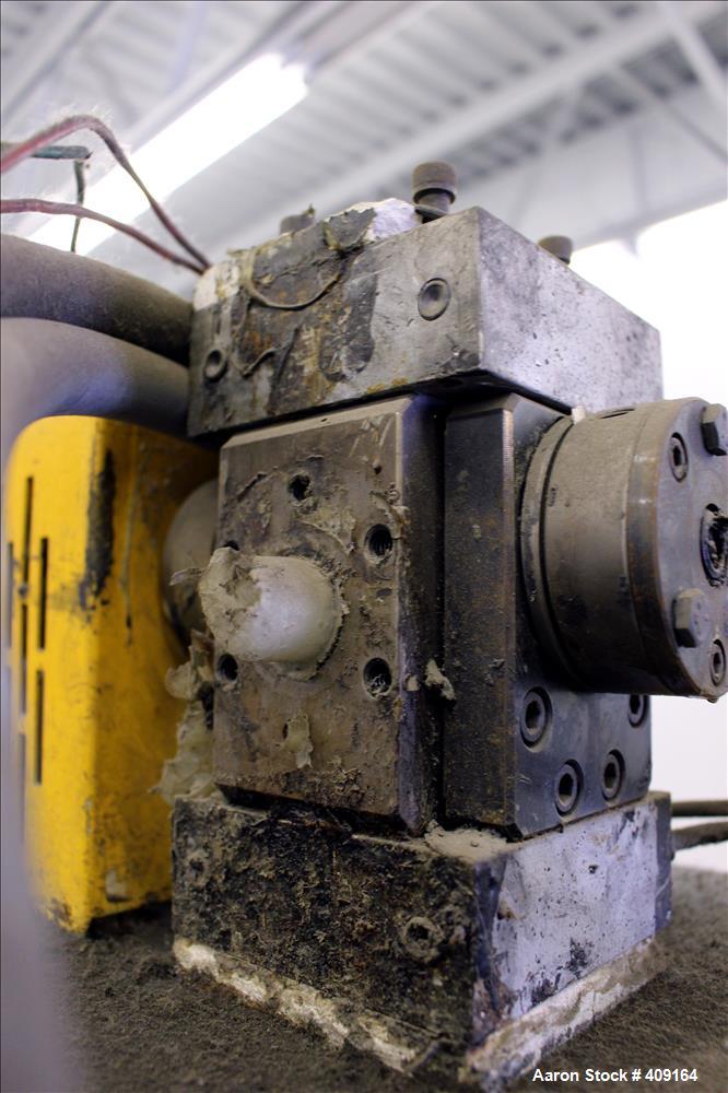 Used Zenith Melt Pump, Model 60-20000-2174-4. Approximate 1" diameter inlet/outlet. Driven by a 1 hp, 3/60/460 volt, 1750 rpm SC motor with reducer, ratio 52.69:1. Mounted on a frame with casters.