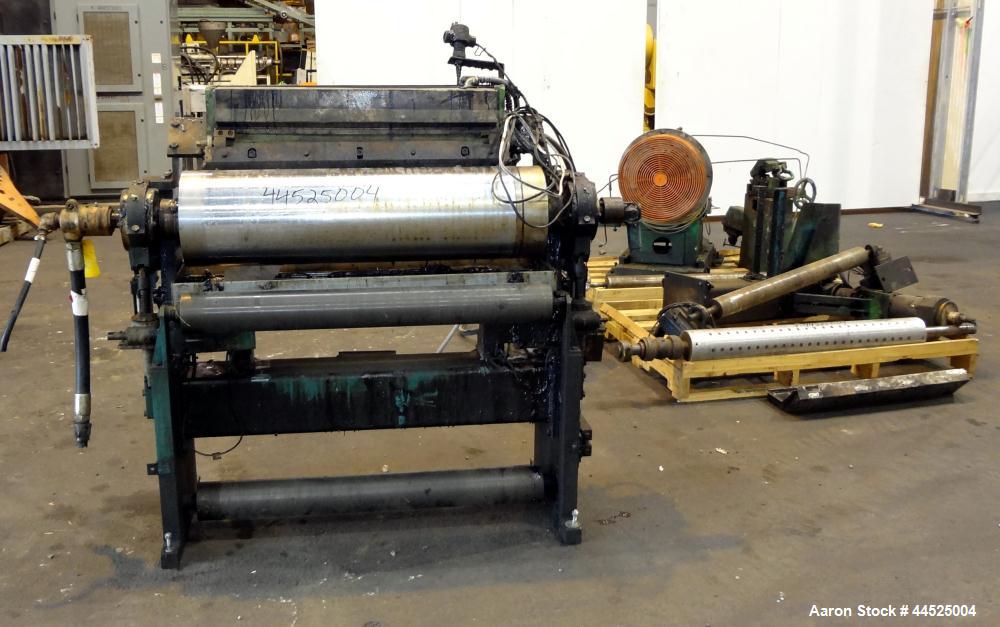 Used Genik Knife-Over-Roll Coater. 12" diameter x 44" face. single roll, chrome plated, water chilled with stationary scraper knife. Manual jack attachment to adjust gap.