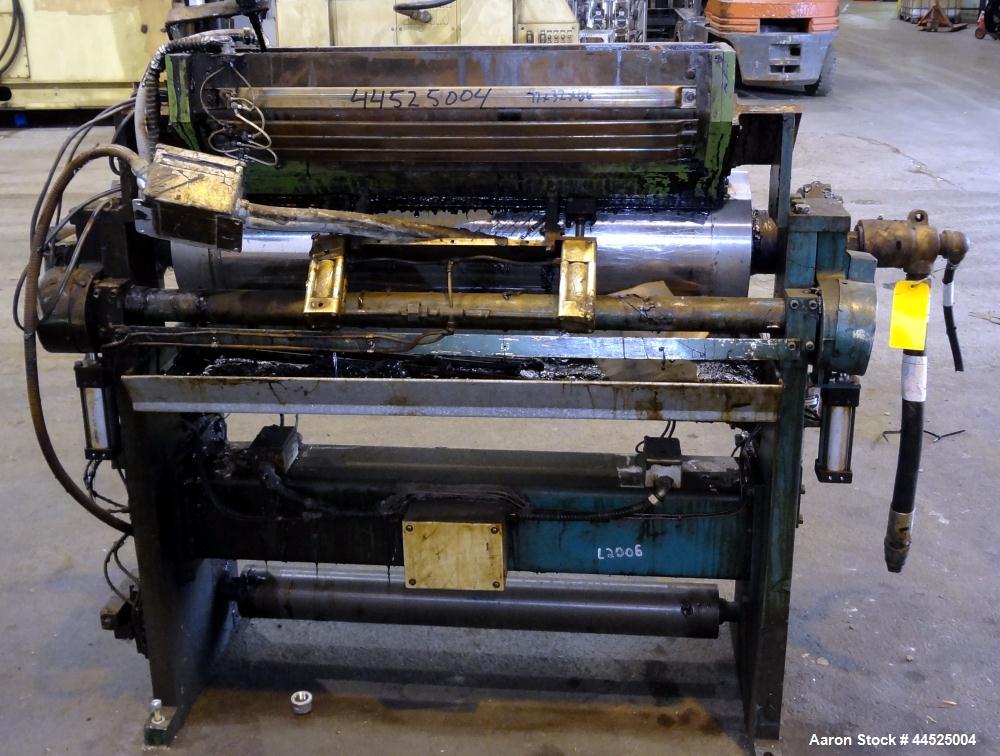 Used Genik Knife-Over-Roll Coater. 12" diameter x 44" face. single roll, chrome plated, water chilled with stationary scraper knife. Manual jack attachment to adjust gap.