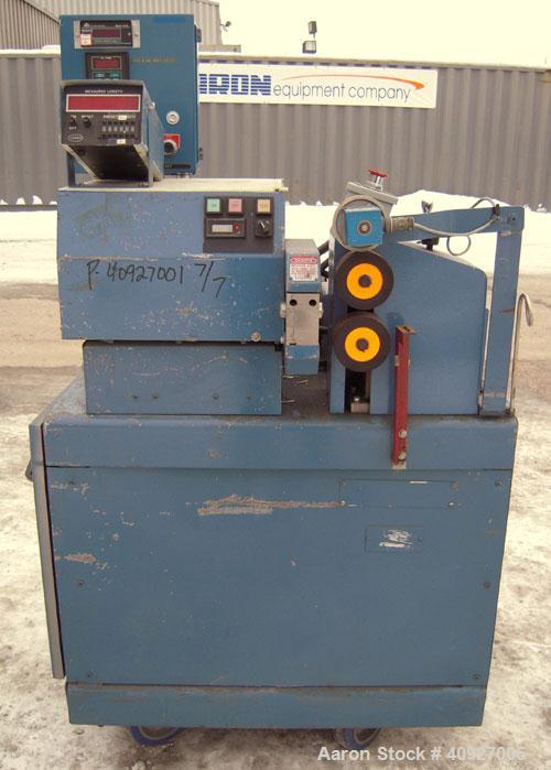 Used Versa Fly Knife Cutter/Puller. (1) Blade fly knife driven by a 3/4 HP, 115/230 Volt, 1725 RPM motor, (2) 2" wide x 4" diameter manually adjustable pull rolls, driven by a 1 1/2 HP, 180 Volt DC m...