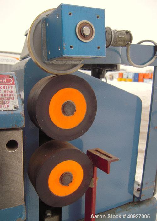 Used Versa Fly Knife Cutter/Puller. (1) Blade fly knife driven by a 3/4 HP, 115/230 Volt, 1725 RPM motor, (2) 2" wide x 4" diameter manually adjustable pull rolls, driven by a 1 1/2 HP, 180 Volt DC m...