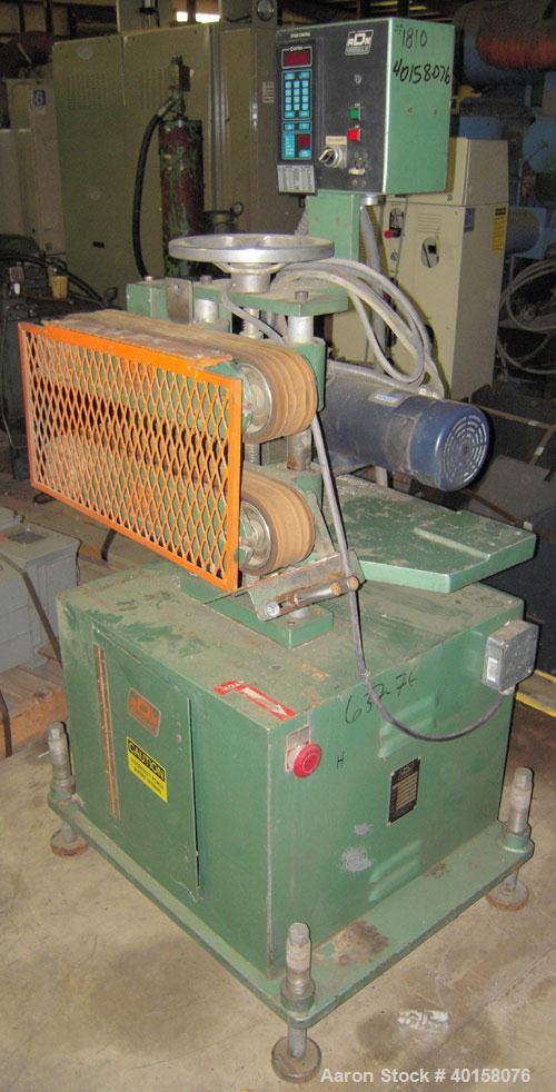 Used RDN belt puller, model 218-3. 3" wide x 18" long contact length belts, manually adjustable. Driven by a 1 1/2 hp motor. Includes operator panel.