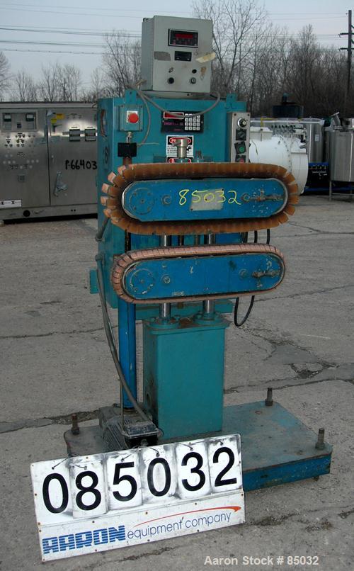 USED: Puller, (2) 4" wide x 25" long contact area, manually adjustable cleated belts. Driven by a 1.5 hp DC gearmotor. Includes a Powertec 500 panel.