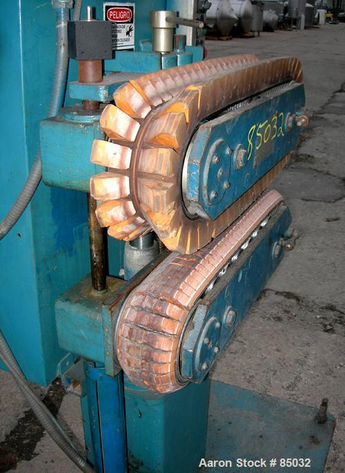 USED: Puller, (2) 4" wide x 25" long contact area, manually adjustable cleated belts. Driven by a 1.5 hp DC gearmotor. Includes a Powertec 500 panel.