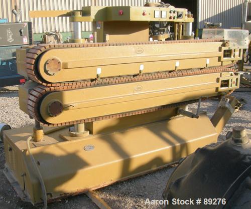 Used Becz Machine Belt Puller, Model 051. (2) 8" wide x 8' long contact area. Top belt motorized adjustment, bottom belt manually adjustable. Driven by an approximate 5 hp motor. Includes control pan...