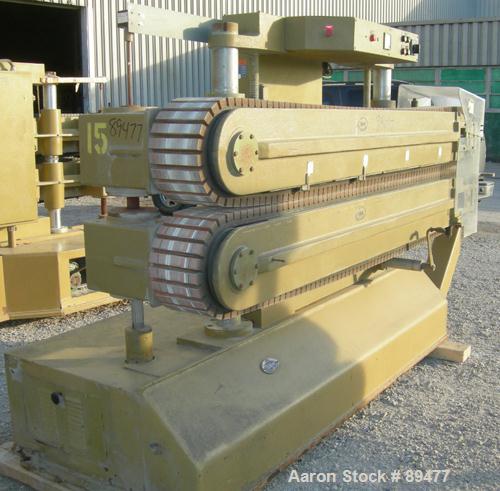 USED: Becz Machine belt puller, model 051. (2) 8" wide x 8' long contact area. Top belt motorized adjustment, bottom belt manually adjustable. Driven by an approximate 5 hp motor. Includes control pa...