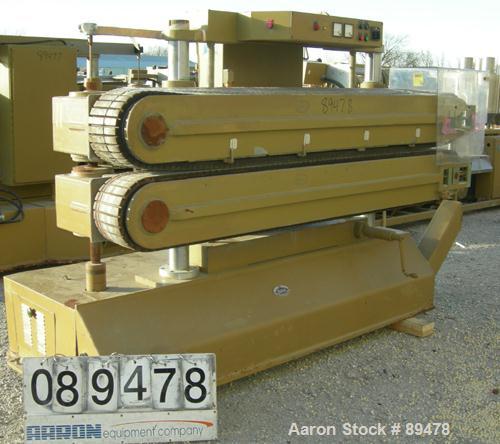 USED: Becz Machine belt puller, model 051. (2) 8" wide x 8' long contact area. Top belt motorized adjustment, bottom belt manually adjustable. Driven by an approximate 5 hp motor. Includes control pa...