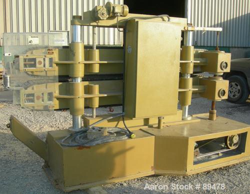 USED: Becz Machine belt puller, model 051. (2) 8" wide x 8' long contact area. Top belt motorized adjustment, bottom belt manually adjustable. Driven by an approximate 5 hp motor. Includes control pa...