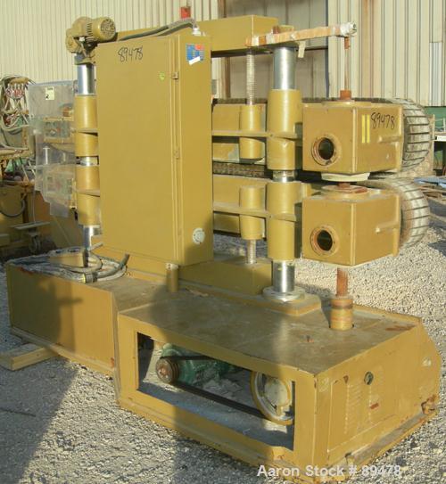 USED: Becz Machine belt puller, model 051. (2) 8" wide x 8' long contact area. Top belt motorized adjustment, bottom belt manually adjustable. Driven by an approximate 5 hp motor. Includes control pa...