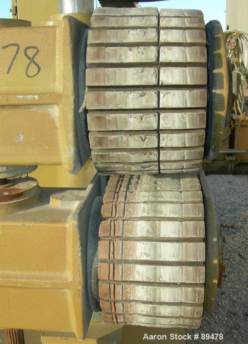 USED: Becz Machine belt puller, model 051. (2) 8" wide x 8' long contact area. Top belt motorized adjustment, bottom belt manually adjustable. Driven by an approximate 5 hp motor. Includes control pa...
