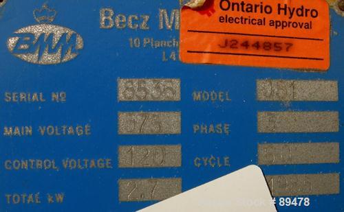 USED: Becz Machine belt puller, model 051. (2) 8" wide x 8' long contact area. Top belt motorized adjustment, bottom belt manually adjustable. Driven by an approximate 5 hp motor. Includes control pa...