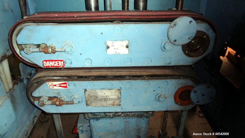 Used- Boston Matthews Belt Puller, Model C-650-VT. (2) Approximately 4" wide x 24" long contact area belts, manually adjusta...