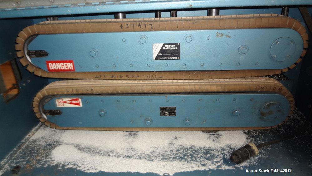 Used Boston Matthews Cleated Belt Puller, Model CWL-600-VT. (2) Approximately 4” wide x 42” long contact area belts, manually adjustable, take off speed range 1 to 60 feet per minute. Driven by a 3 h...