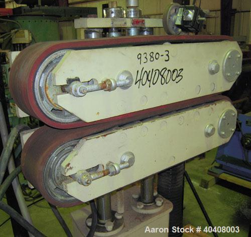 Used Farris model C550VT belt puller having two approximately 4" wide belts with 21" of contact length. Belts are driven by an approximate 1 hp AC motor with an inverter thru a multiple speed gearbox...