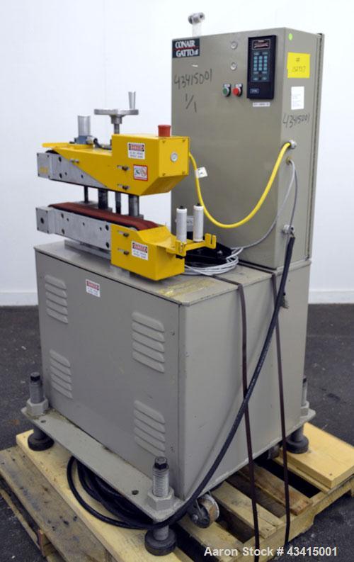 Used Conair Jetro Gatto Puller, Model 3-20. (2) 3” Wide x 20" long contact area. Manually adjustable rubber belts. Maximum feed opening 4” high. Driven by a 1.5 hp, 180 volt, 1750 rpm DC motor with r...